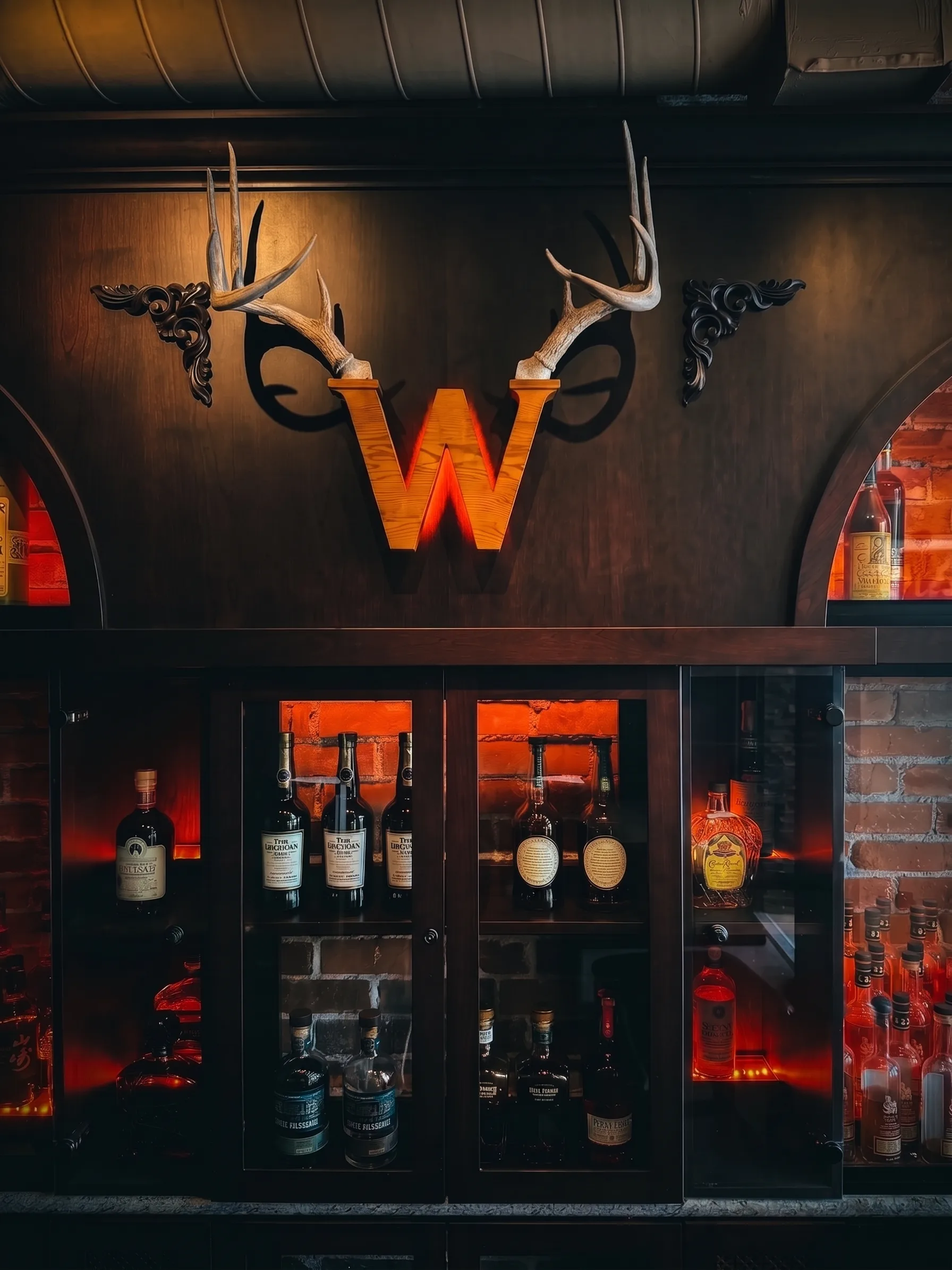 The official Whisk(e)y antler W above the back bar